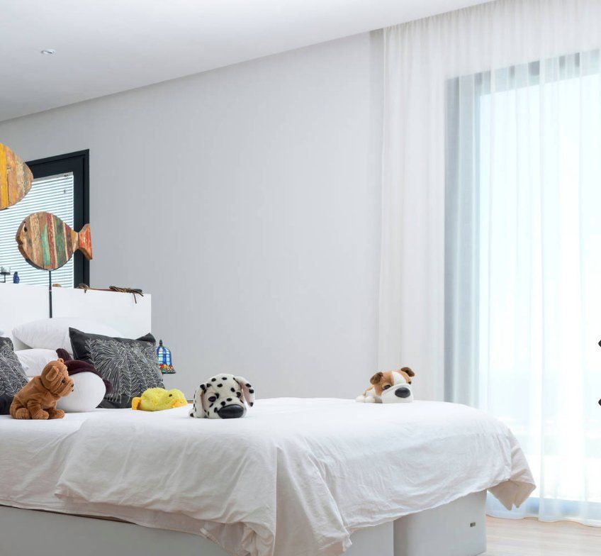 Stuffed Toys On A Bed & A White Sheer Curtains — Studio Curtains & Blinds in Mount Gravatt, QLD
