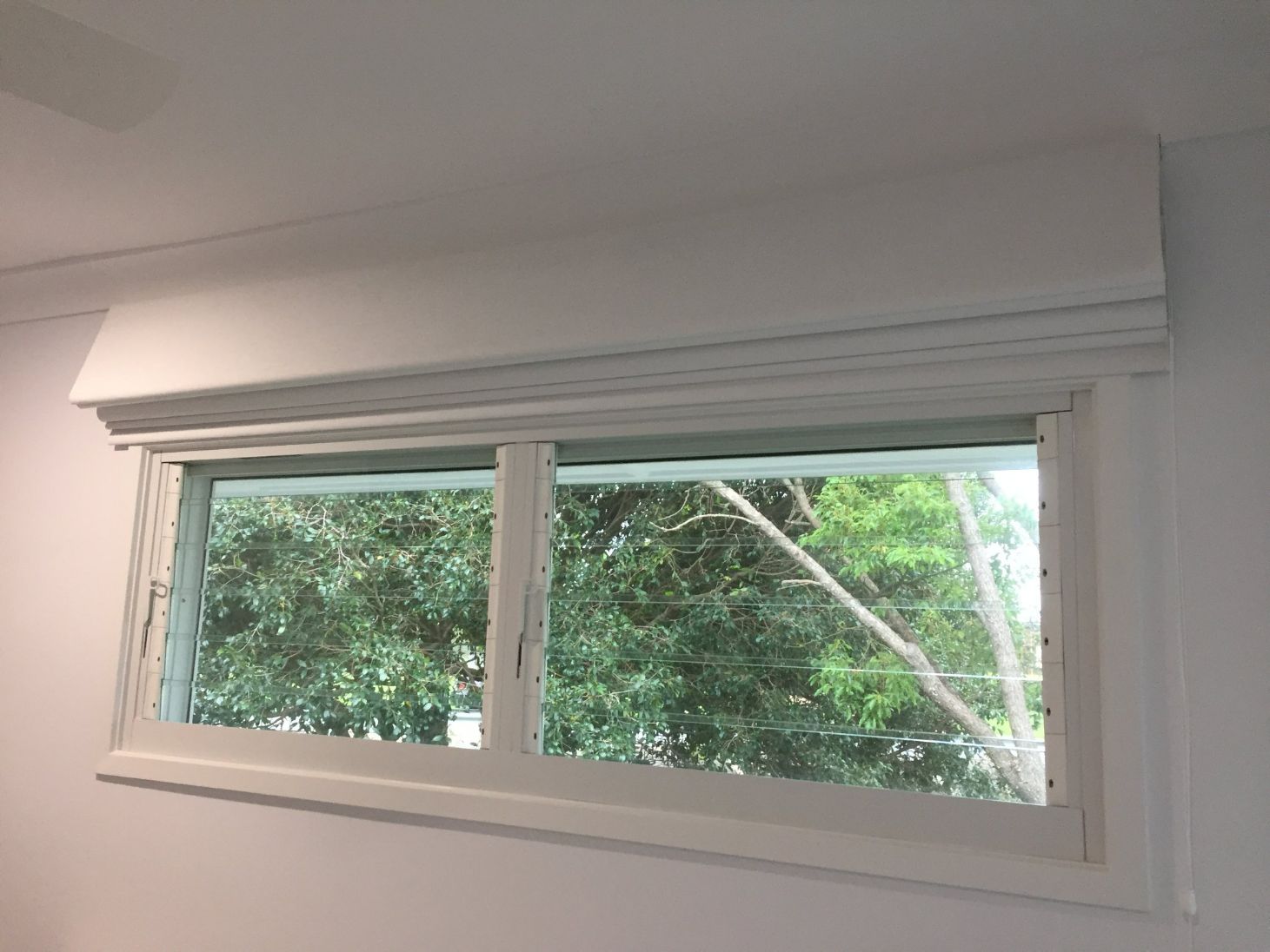White Roman Blinds On A Jalousie Windows — Studio Curtains & Blinds in Mount Gravatt, QLD