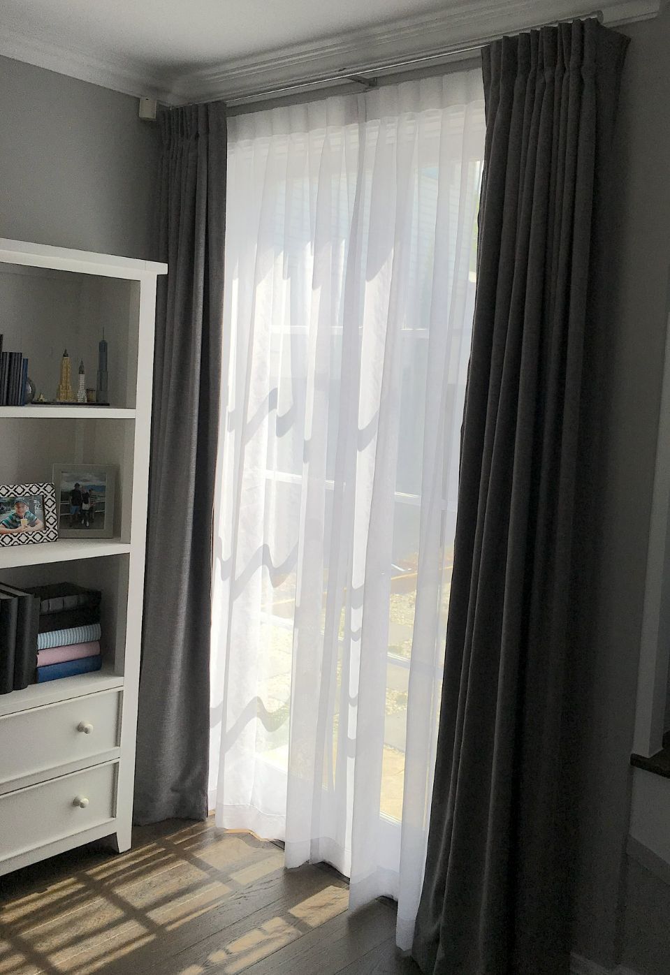 Sunlight Shining Through White Inverted Pleat Curtains — Studio Curtains & Blinds in Mount Gravatt, QLD