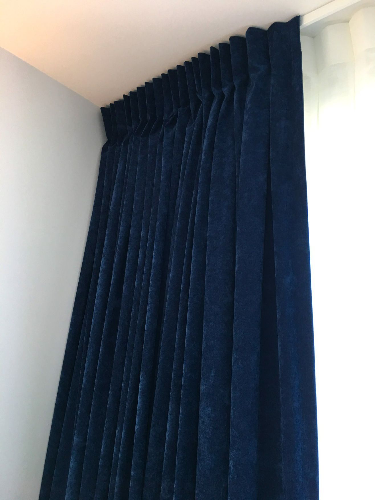 Midnight blue velvet curtains adding an elegant touch to the room's decor