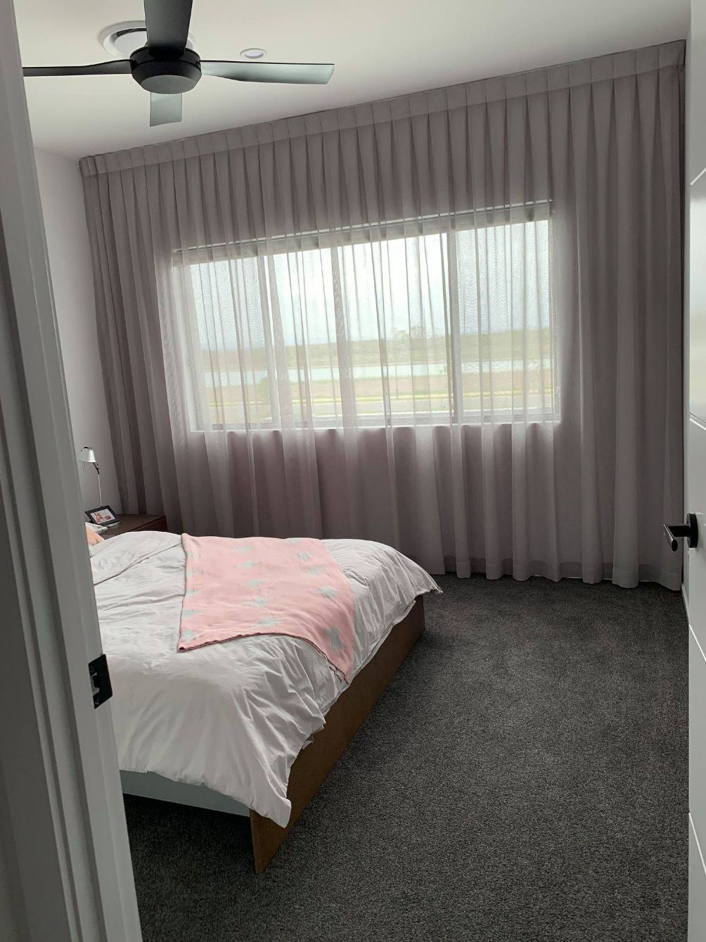 Inverted Pleat Curtains In A Bedroom — Studio Curtains & Blinds in Mount Gravatt, QLD