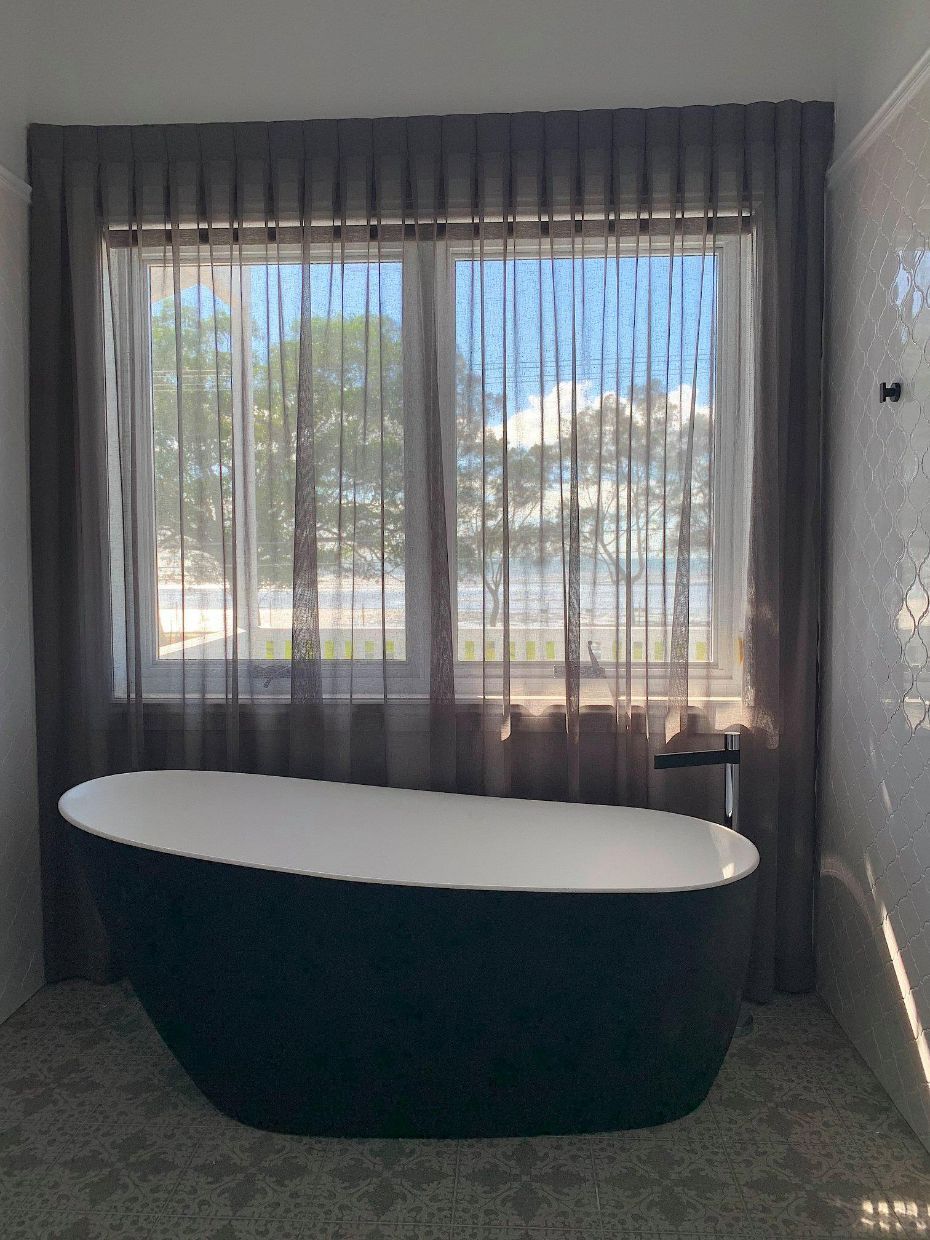 Sheer Inverted Pleat Curtains & A Bathtub — Studio Curtains & Blinds in Mount Gravatt, QLD