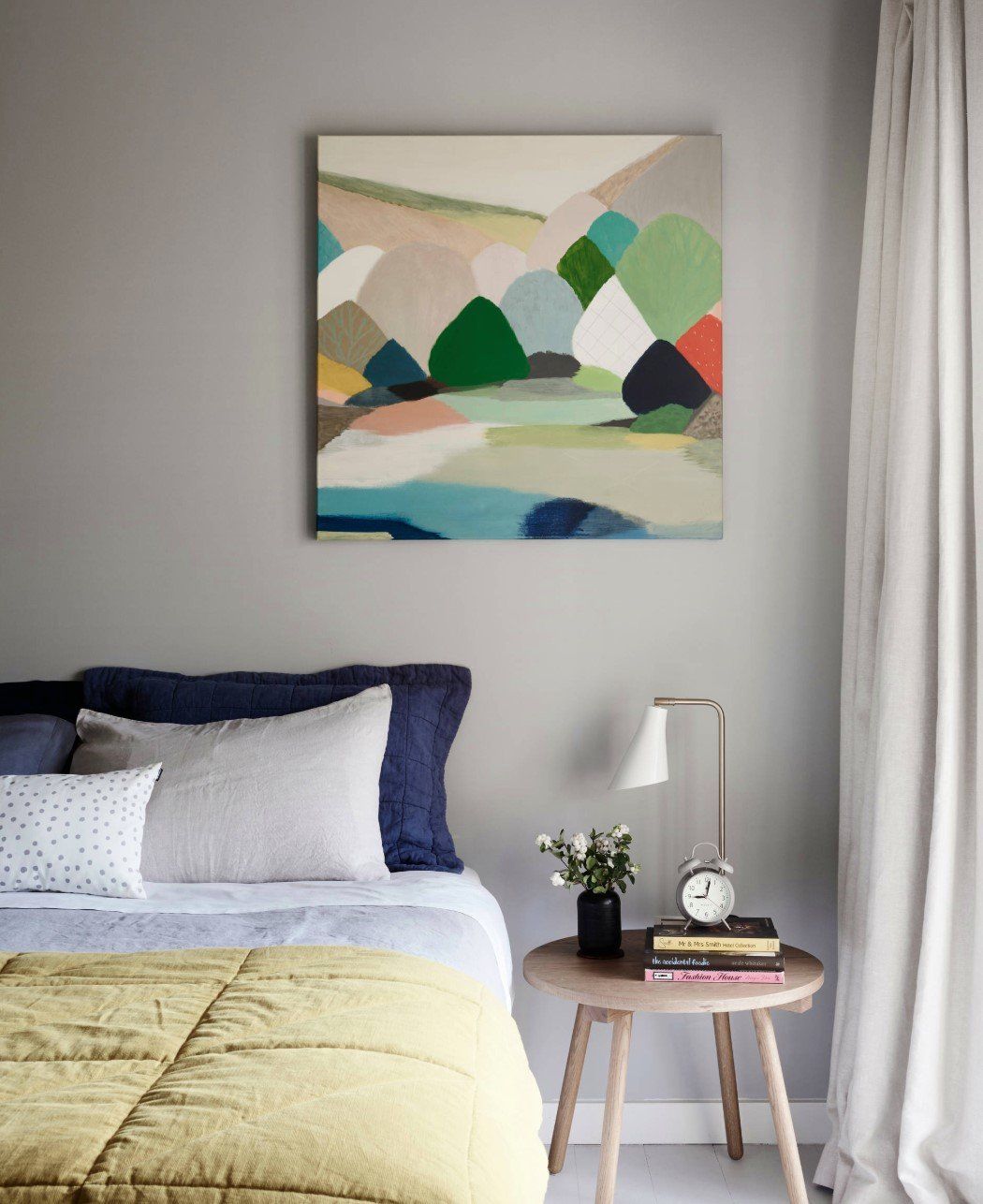 Cozy Bed With Nice Painting Hanging On The Wall — Studio Curtains & Blinds in Mount Gravatt, QLD