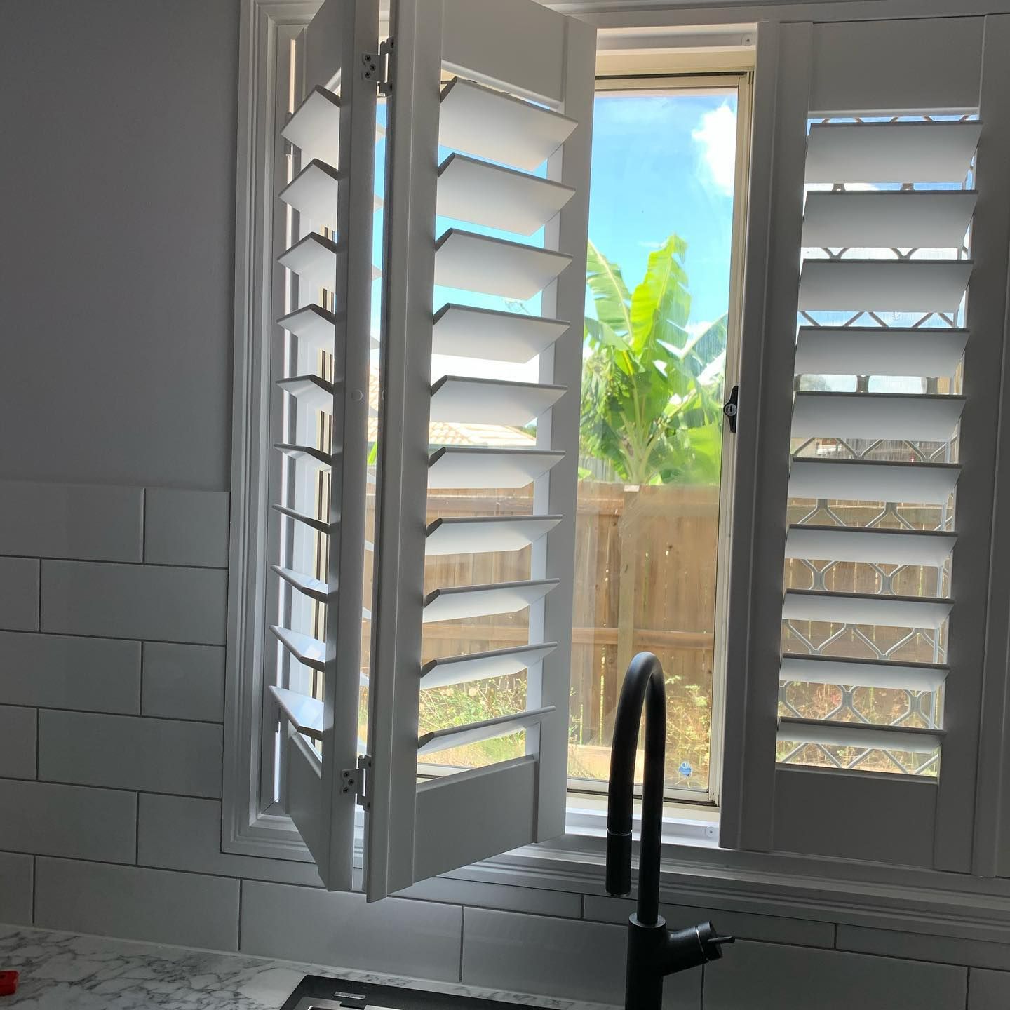 Double Hinged Shutters & Sink Tap — Studio Curtains & Blinds in Mount Gravatt, QLD