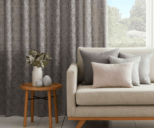 Window Curtains & A Cozy Sofa — Studio Curtains & Blinds in Mount Gravatt, QLD