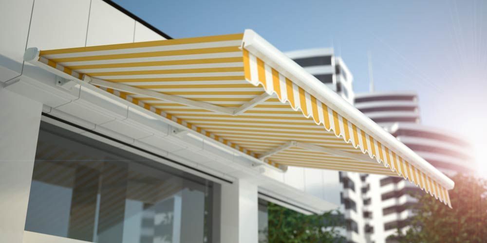 White And Yellow Colored Awning In A Shop — Studio Curtains & Blinds in Mount Gravatt, QLD