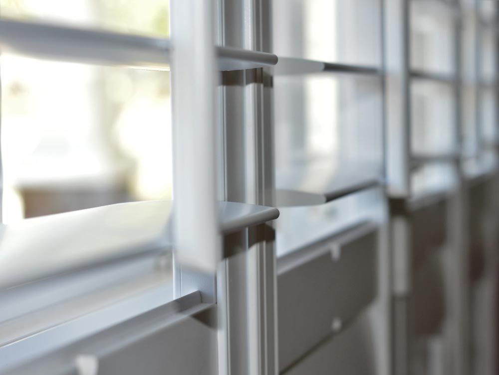 Closeup On A White Plantation Shutters — Curtains in South Brisbane, QLD