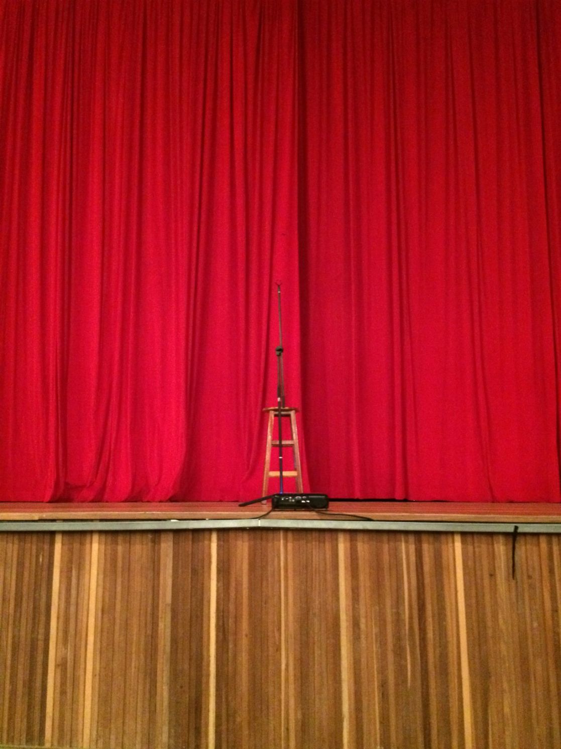 Red Curtains & A Mic Stand On A Wooden Floor — Studio Curtains & Blinds in Mount Gravatt, QLD