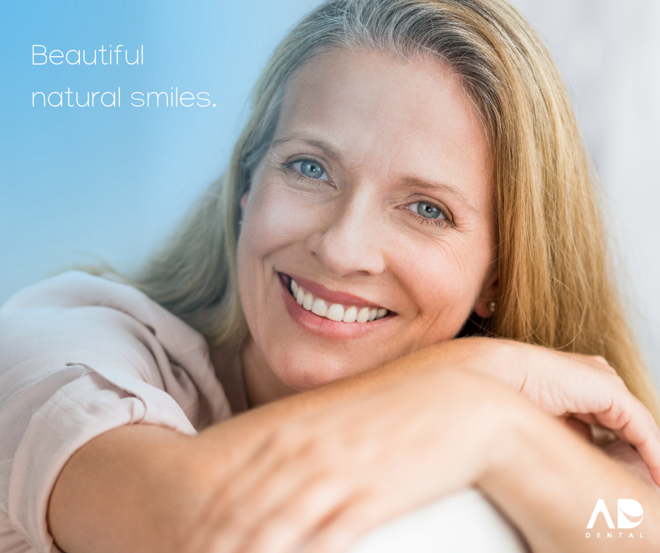 Woman smiling with a natural smile. Woman smiling with a natural smile.