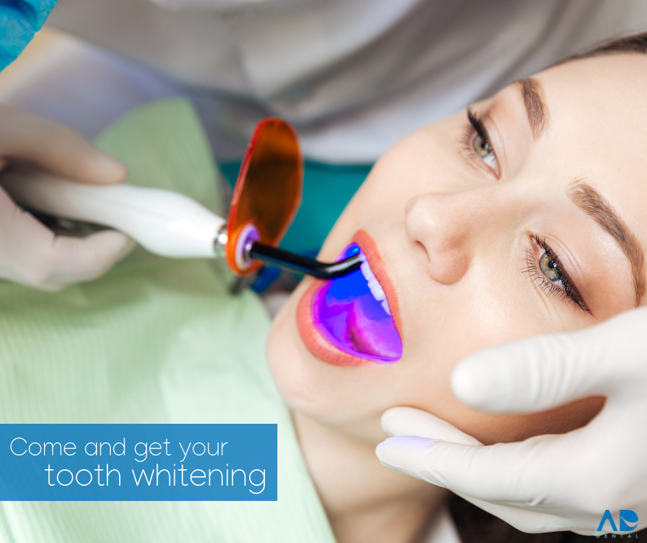 Woman undergoing teeth whitening treatment with dental equipment. Woman undergoing teeth whitening treatment with dental equipment.