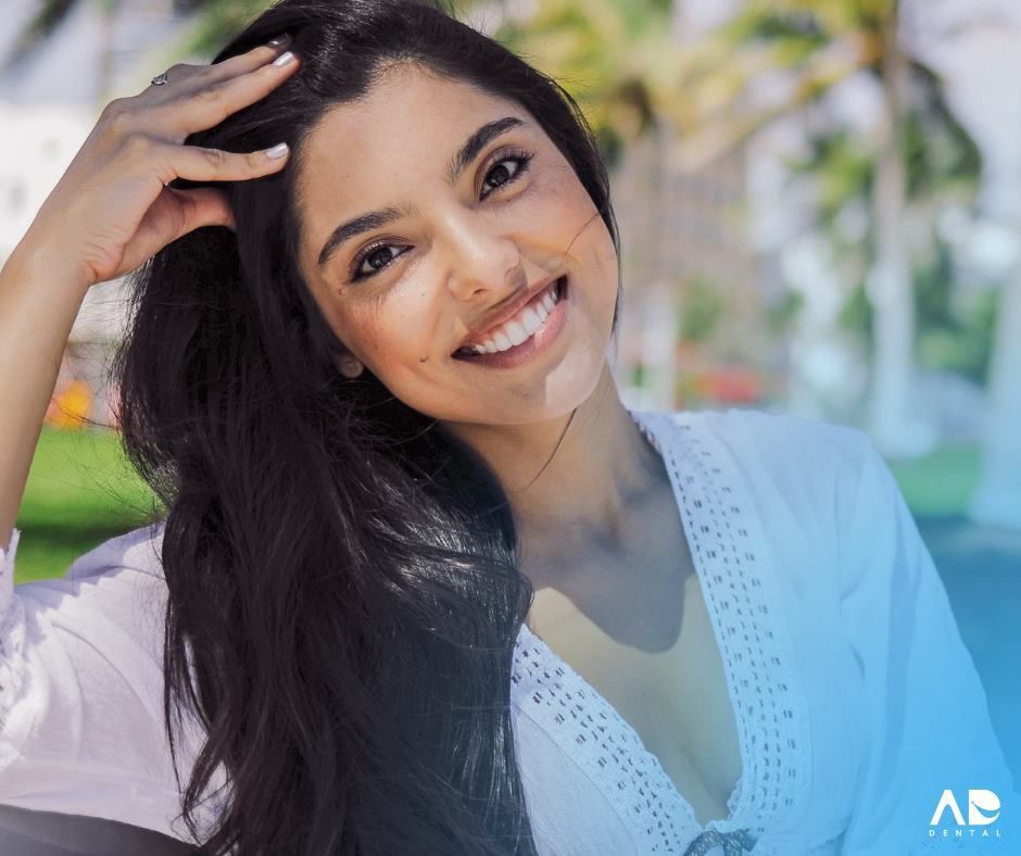 Woman smiles, hand in hair. Woman smiles, hand in hair.