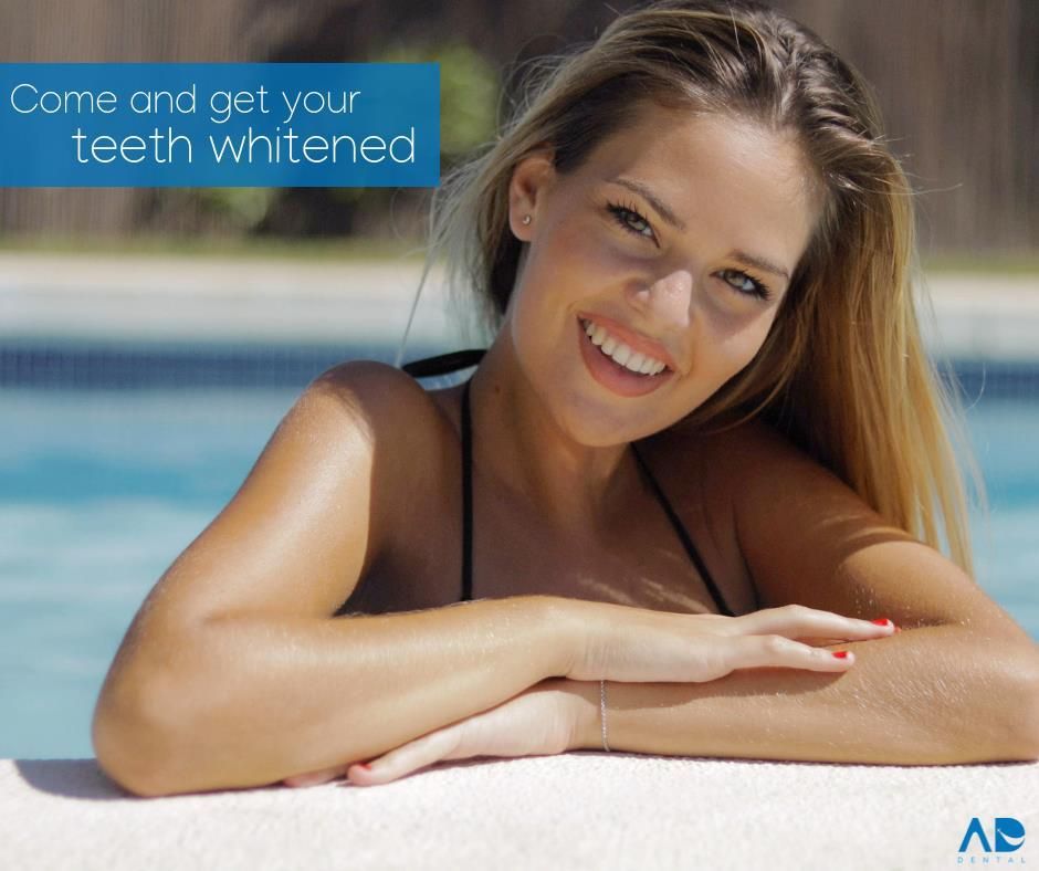 Woman smiling by a pool, advertising teeth whitening. Woman smiling by a pool, advertising teeth whitening.