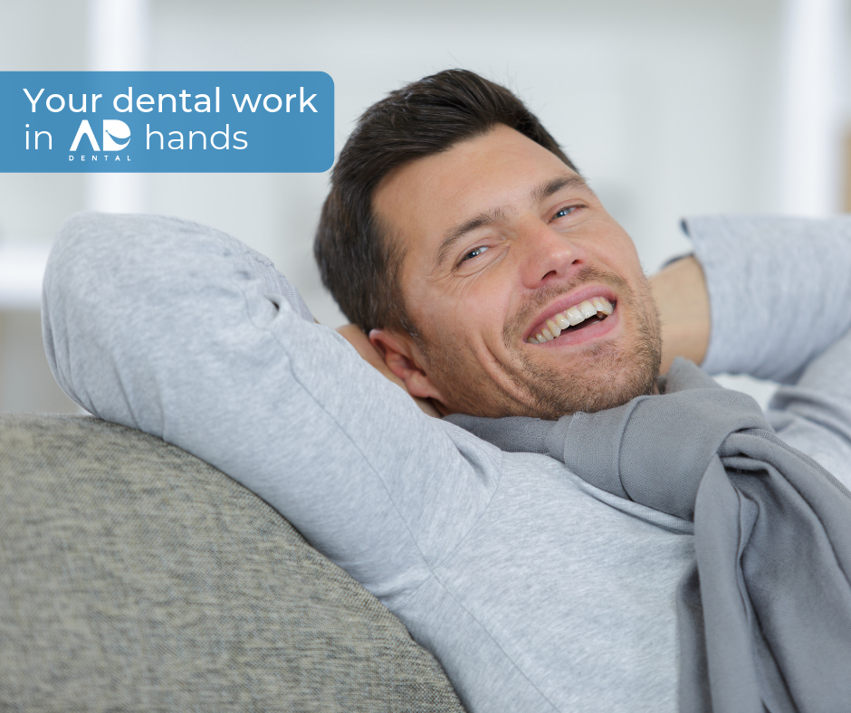 Man smiling, relaxing on a couch. Man smiling, relaxing on a couch.