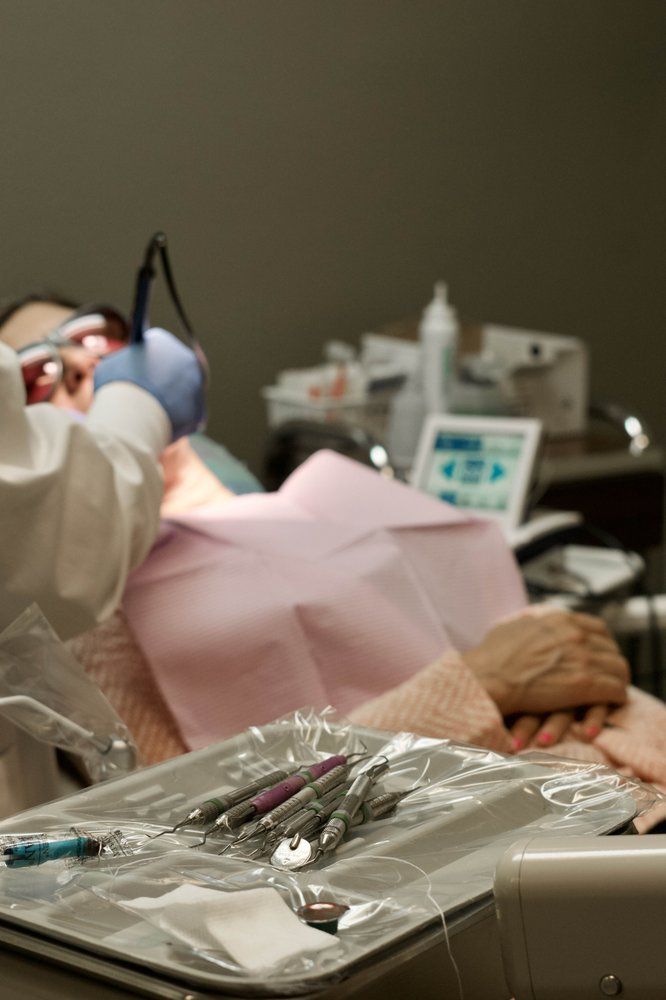 Dentist examining patient's teeth. 