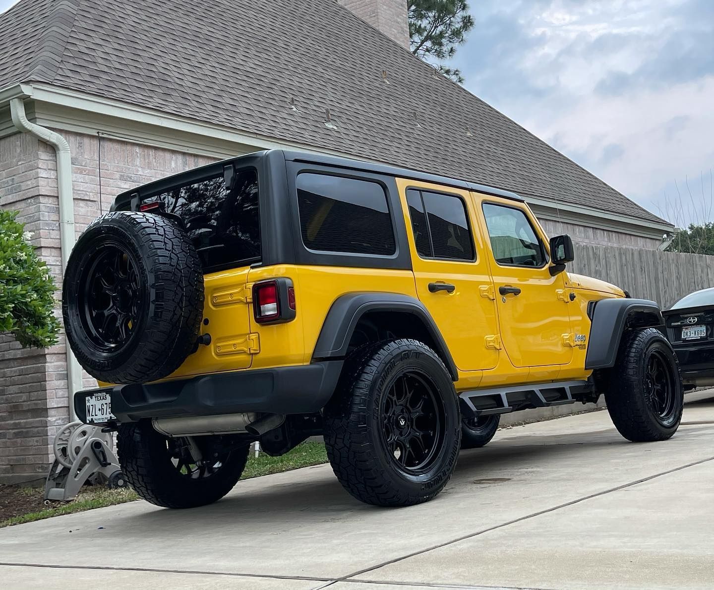 yellow vehicle with ceramic coating parked outside