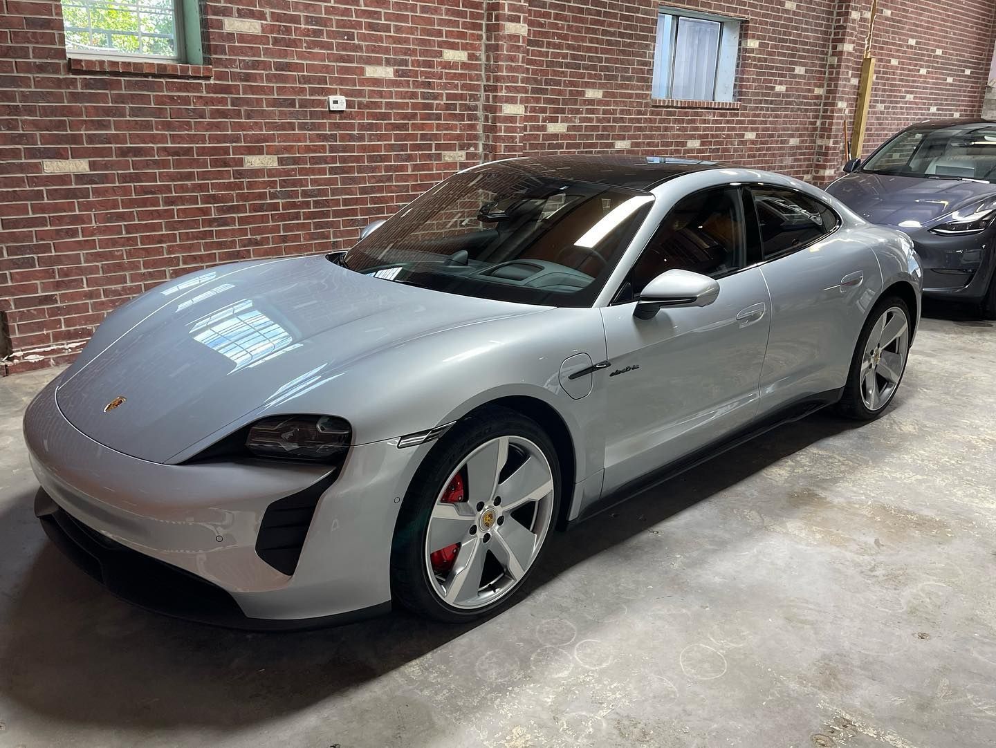 gray car inside the detailing shop