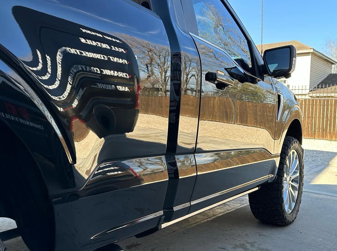 black vehicle with ceramic coating parked outside