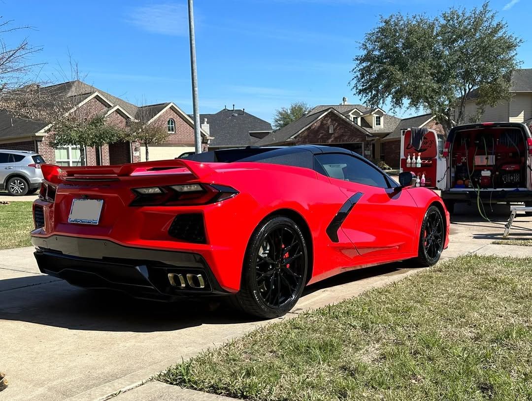 ceramic coated red car parked outside