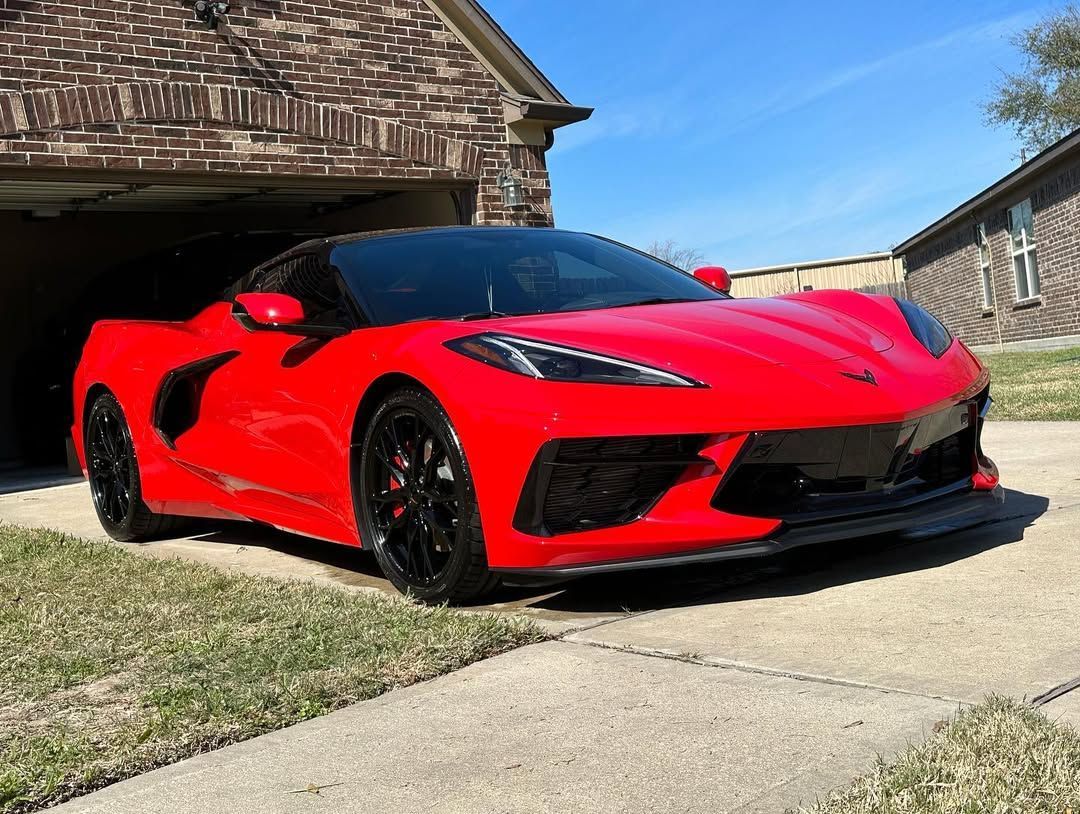 red vehicle with ceramic coating parked under the sun