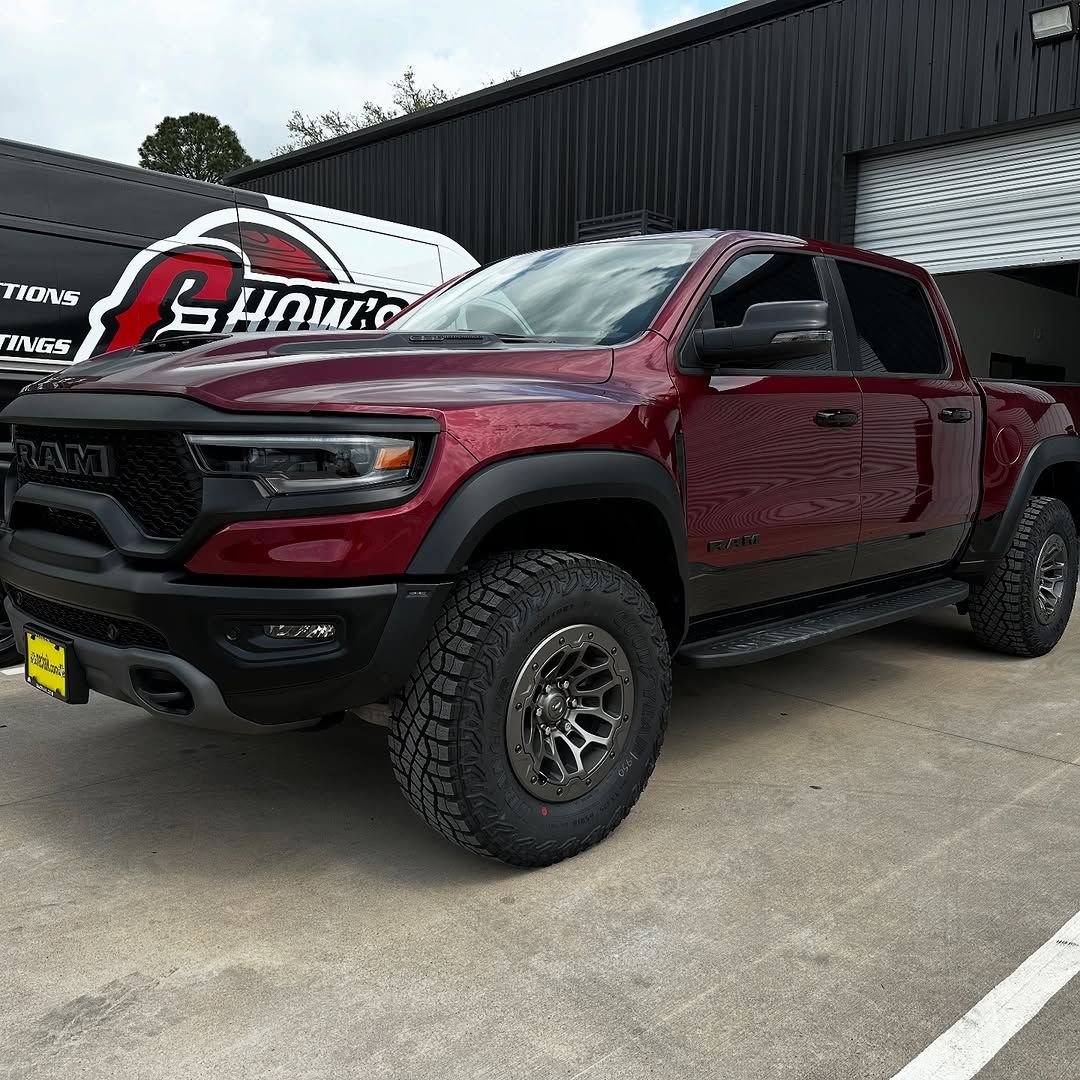 red vehicle with ceramic coating parked outside