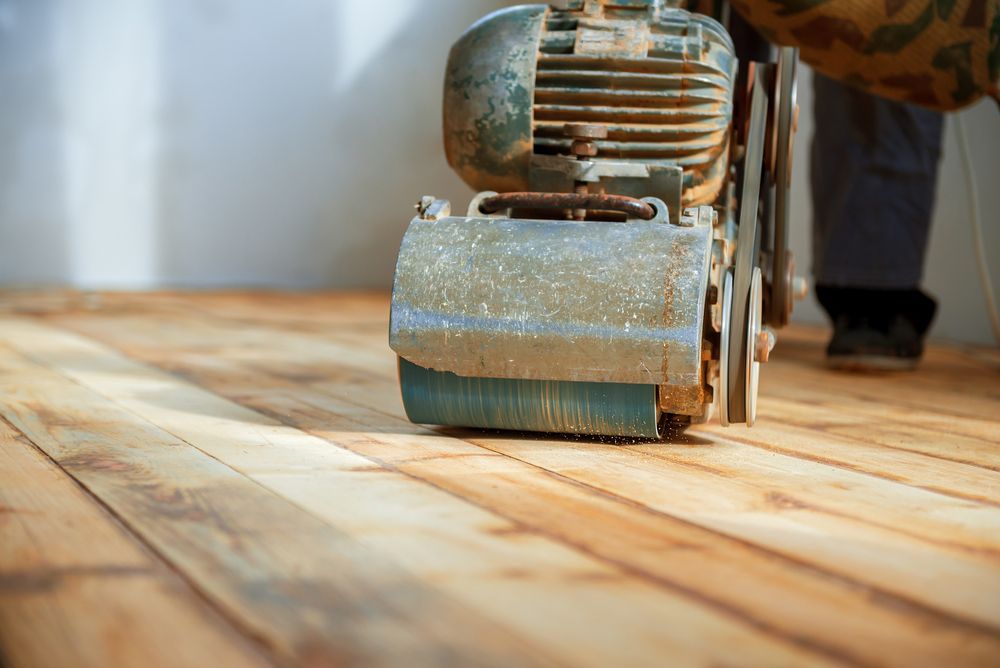 Floor Sander Smoothing a Wooden Floor — Unique Floors In New Town, TAS