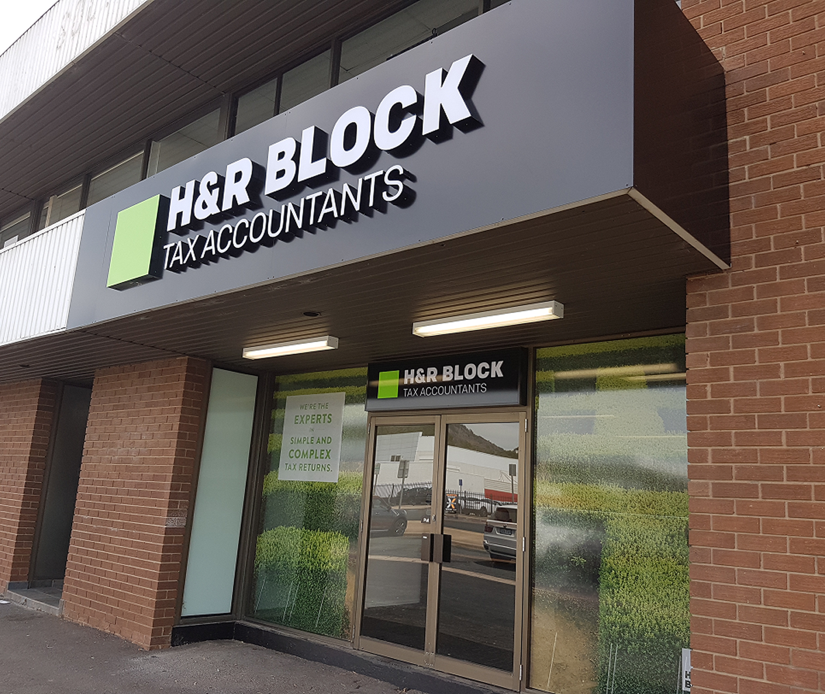A brick building with a sign that says h & r block tax accountants A brick building with a sign that says h & r block tax accountants