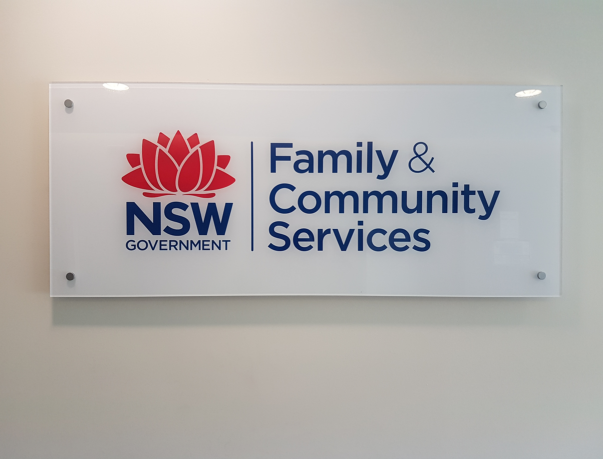 A sign on a wall that says family and community services A sign on a wall that says family and community services