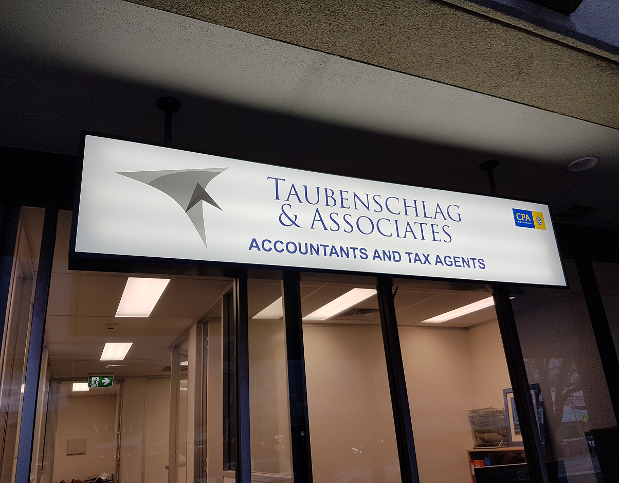 A sign that says tauwin & associates accountants and tax advisers A sign that says tauwin & associates accountants and tax advisers