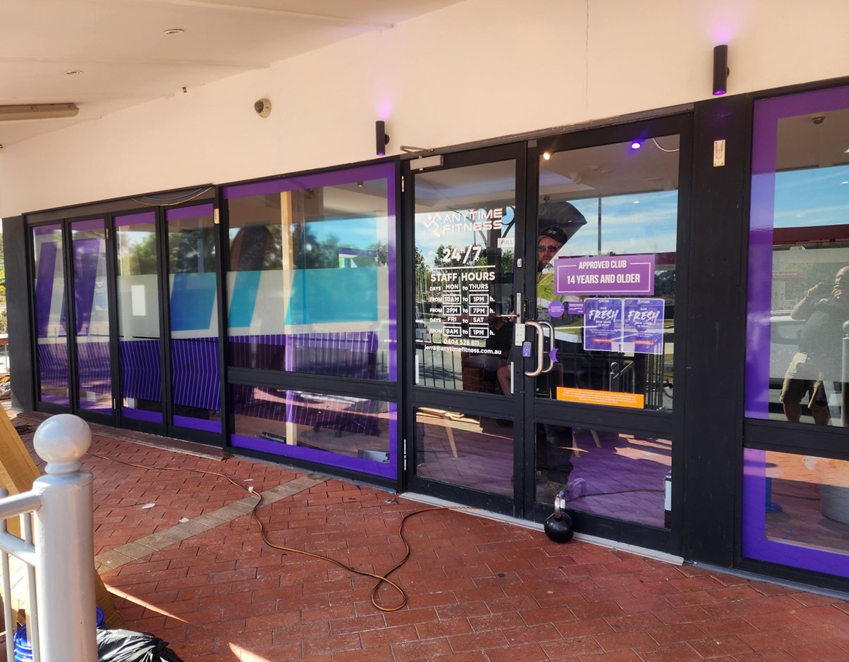 A building with purple windows and purple curtains. A building with purple windows and purple curtains.