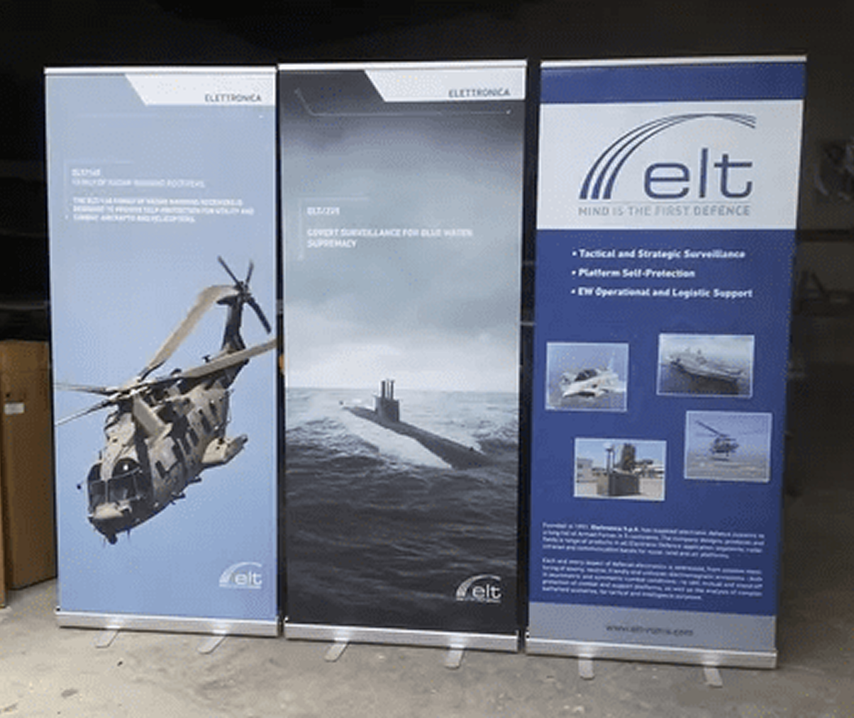 Three banners with a helicopter a submarine and the word elt on them Three banners with a helicopter a submarine and the word elt on them