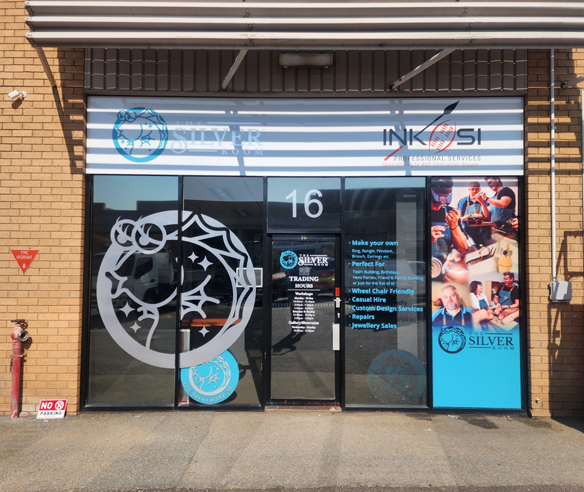 The front of a building with the number 16 on it The front of a building with the number 16 on it