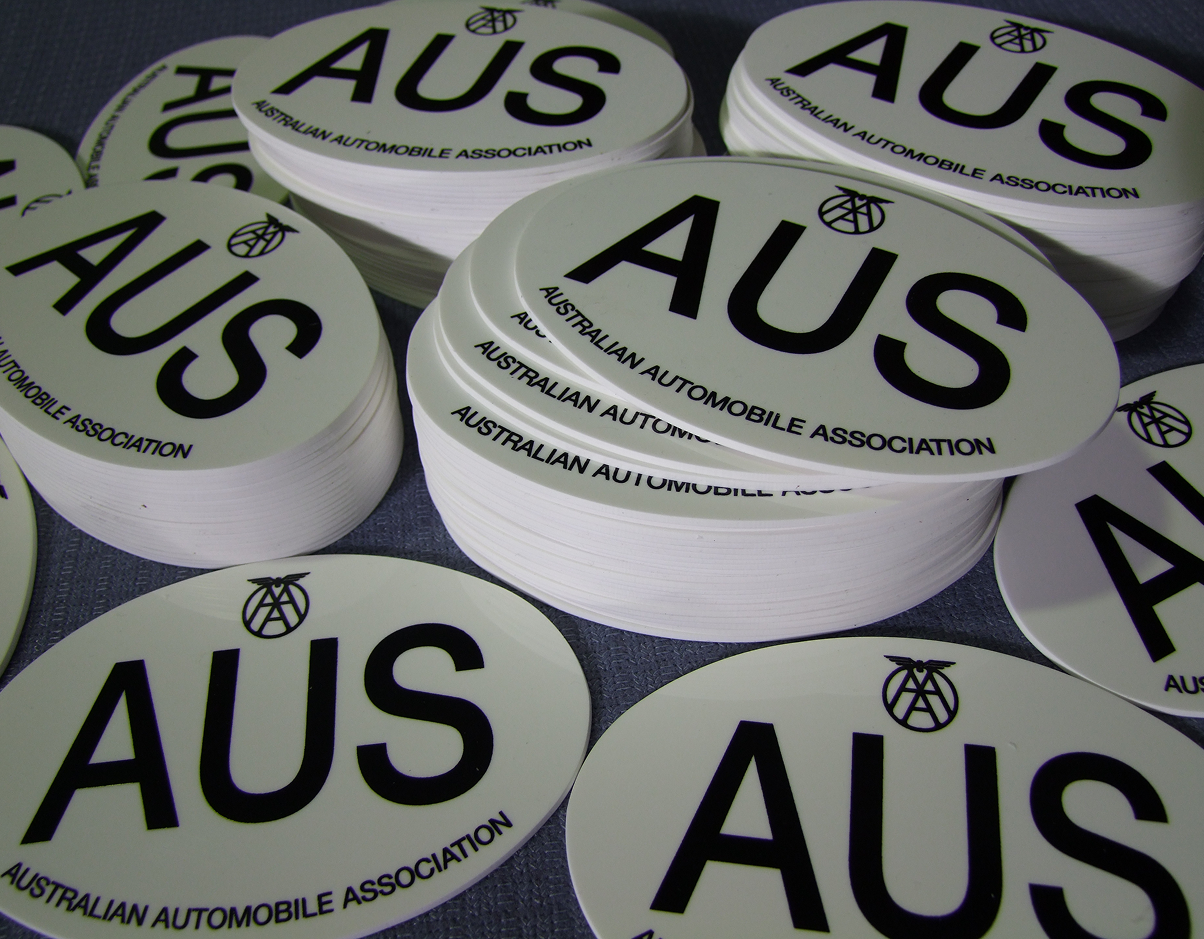 A bunch of aus stickers are stacked on top of each other A bunch of aus stickers are stacked on top of each other