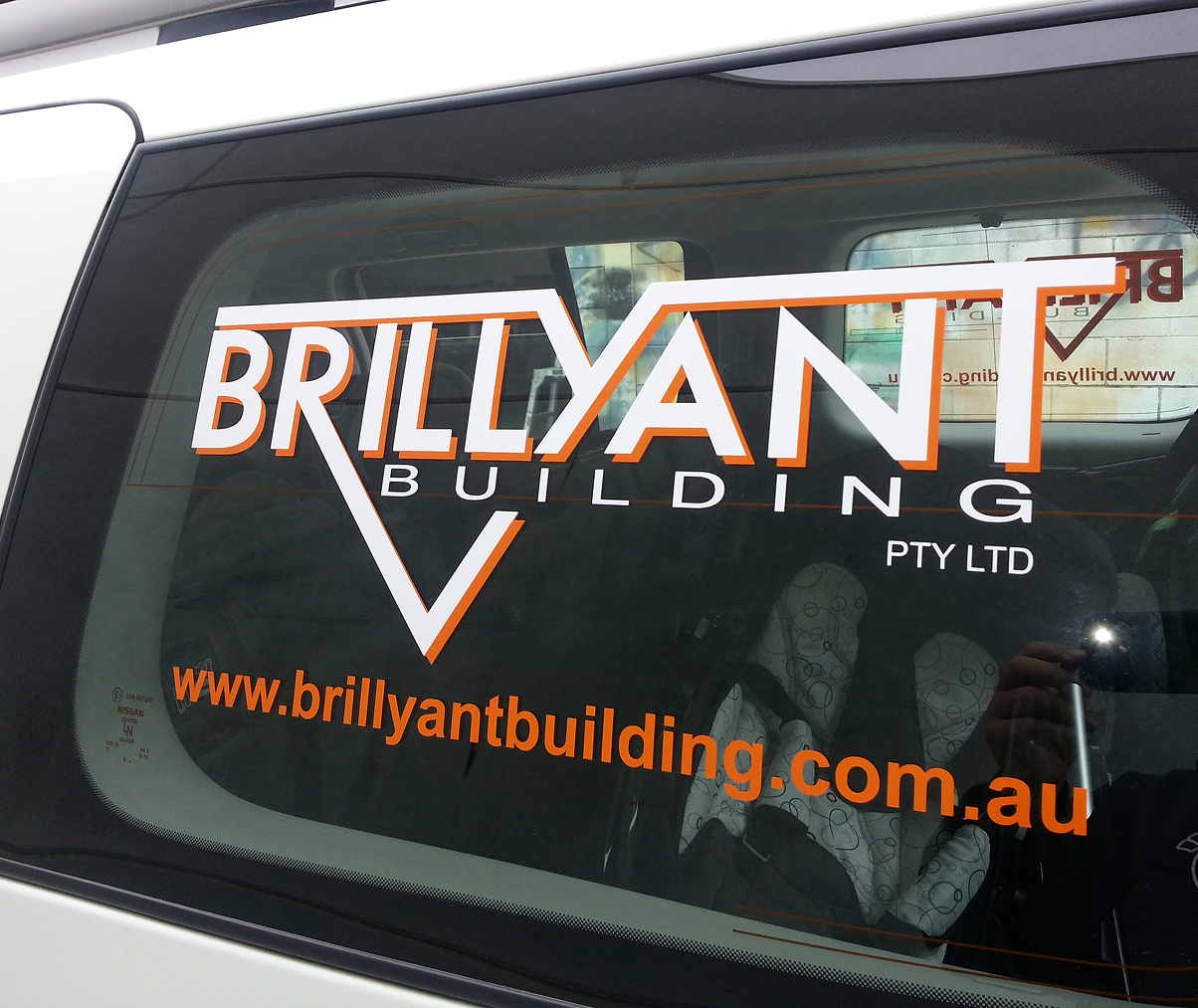 A car with a brilliant building sticker on the window A car with a brilliant building sticker on the window
