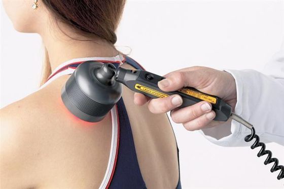 Handheld laser over woman's left shoulder