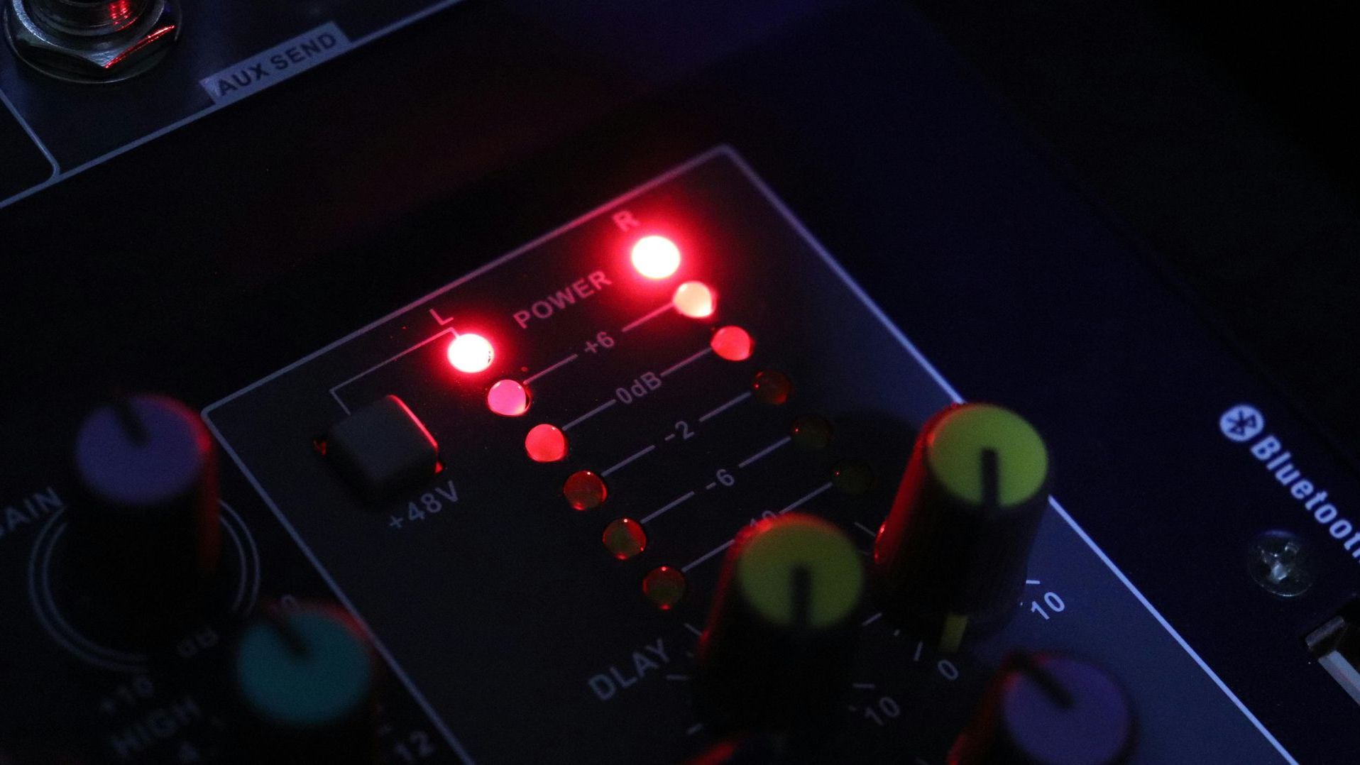 A close up of a mixer with red lights on it