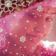 A close up of a woman 's face with flowers on it.