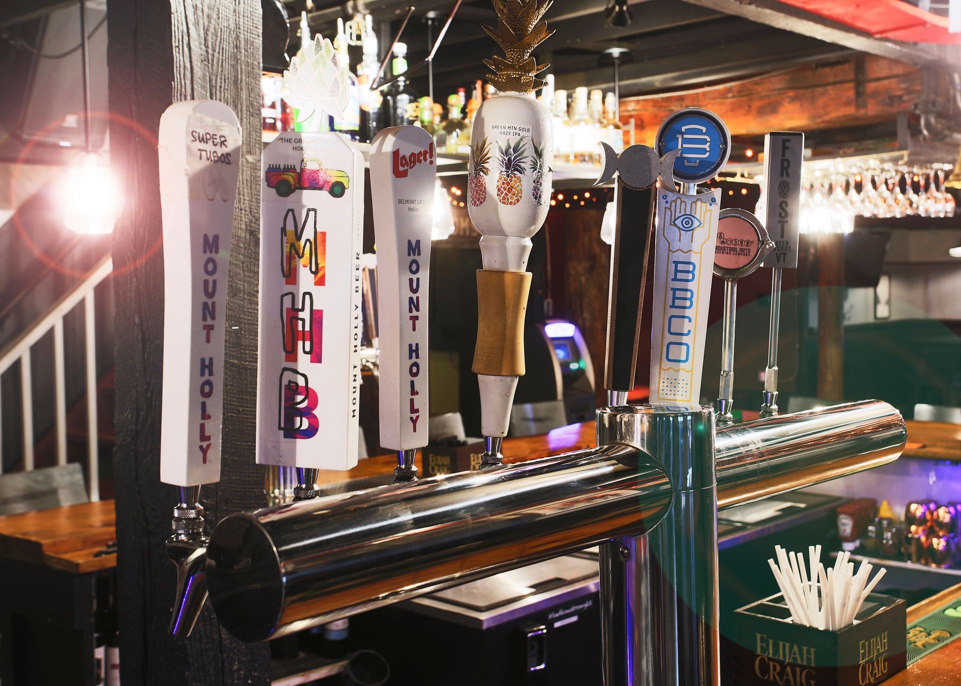 A bar with a lot of beer taps on it