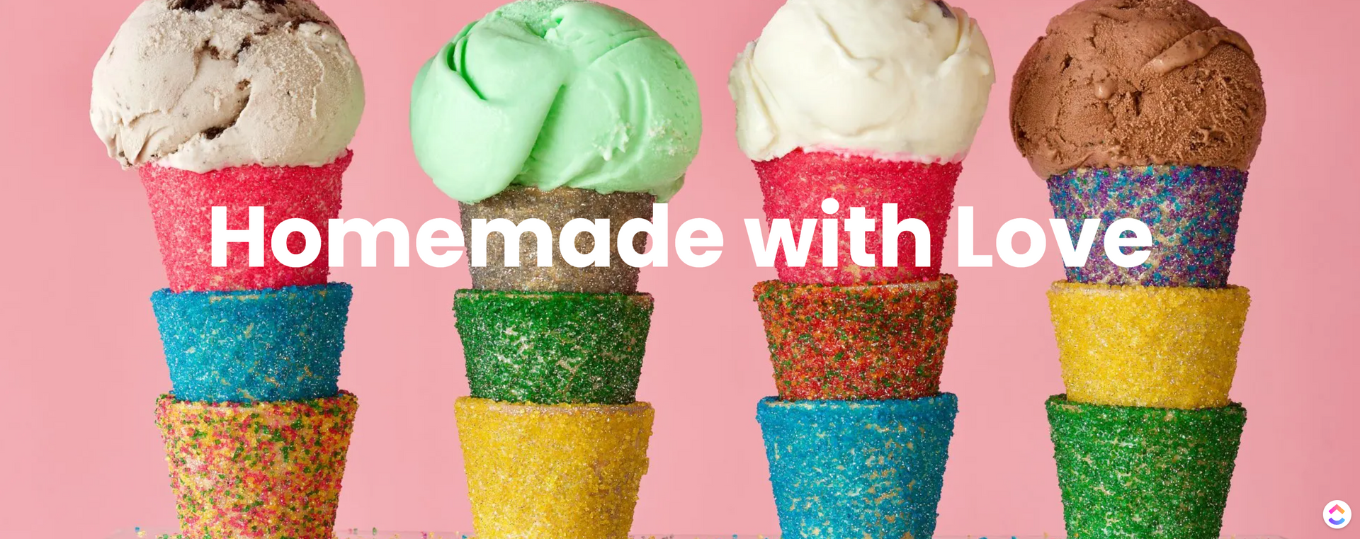 Four ice cream cones are stacked on top of each other on a pink background.