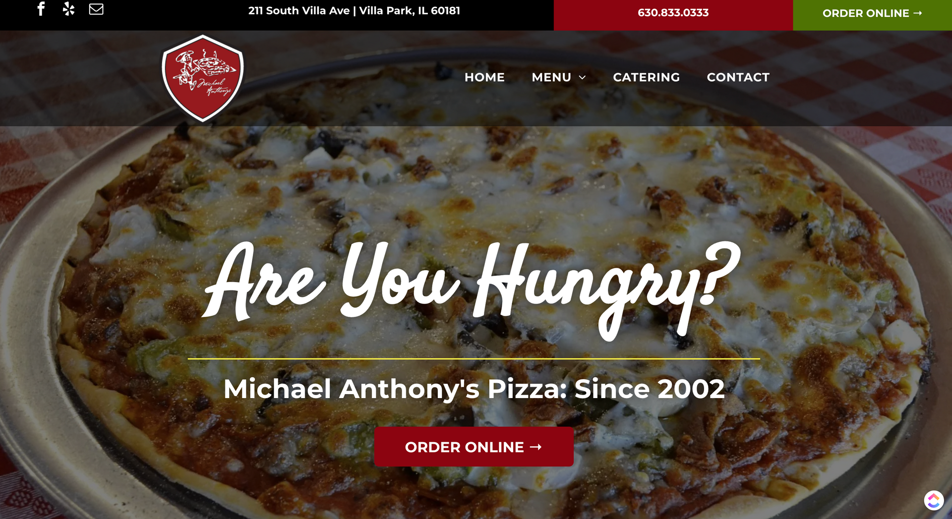 A pizza on a plate with the words `` are you hungry '' written on it.