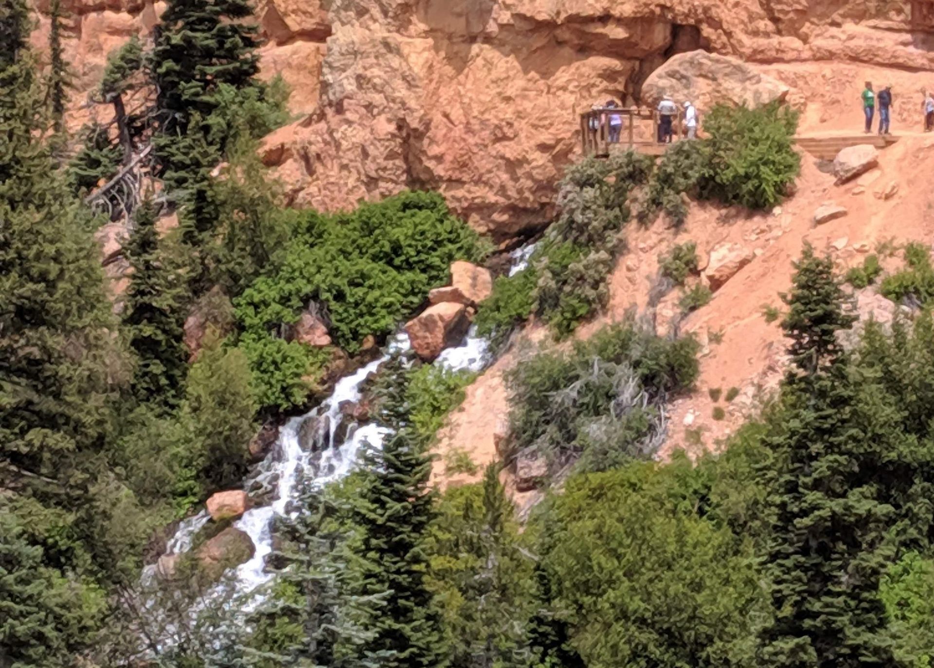 A sunset over a mountain range with a lot of fog