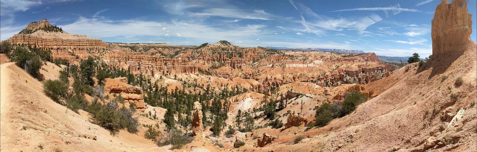 A sunset over a mountain range with a lot of fog