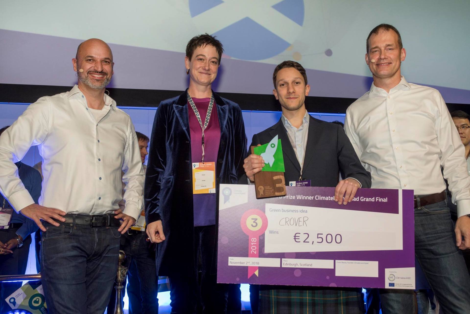 Crover receiving prize. From left to right: Hans Westerhof (Project Lead - ClimateLaunchpad), Kirsten Dunlop (CEO - ClimateKIC), Lorenzo Conti (Founder - Crover Ltd), Frans Nauta (Project Lead - ClimateLaunchpad)
