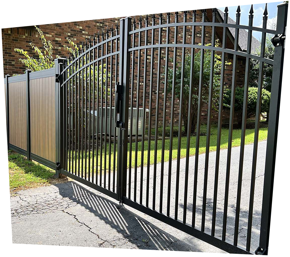 A white vinyl fence with a tree in the background