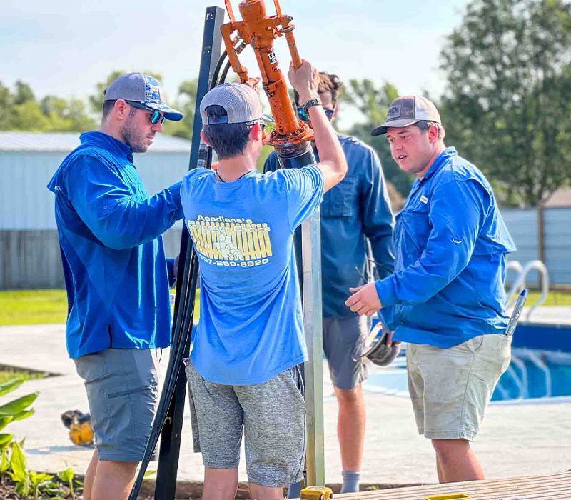 A group of men are working on a swimming pool.