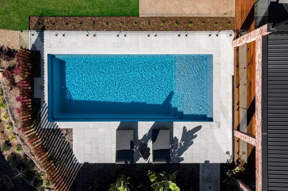 An Aerial View of a Swimming Pool in a Backyard  — Aqualine Pools in Burnett Heads, QLD