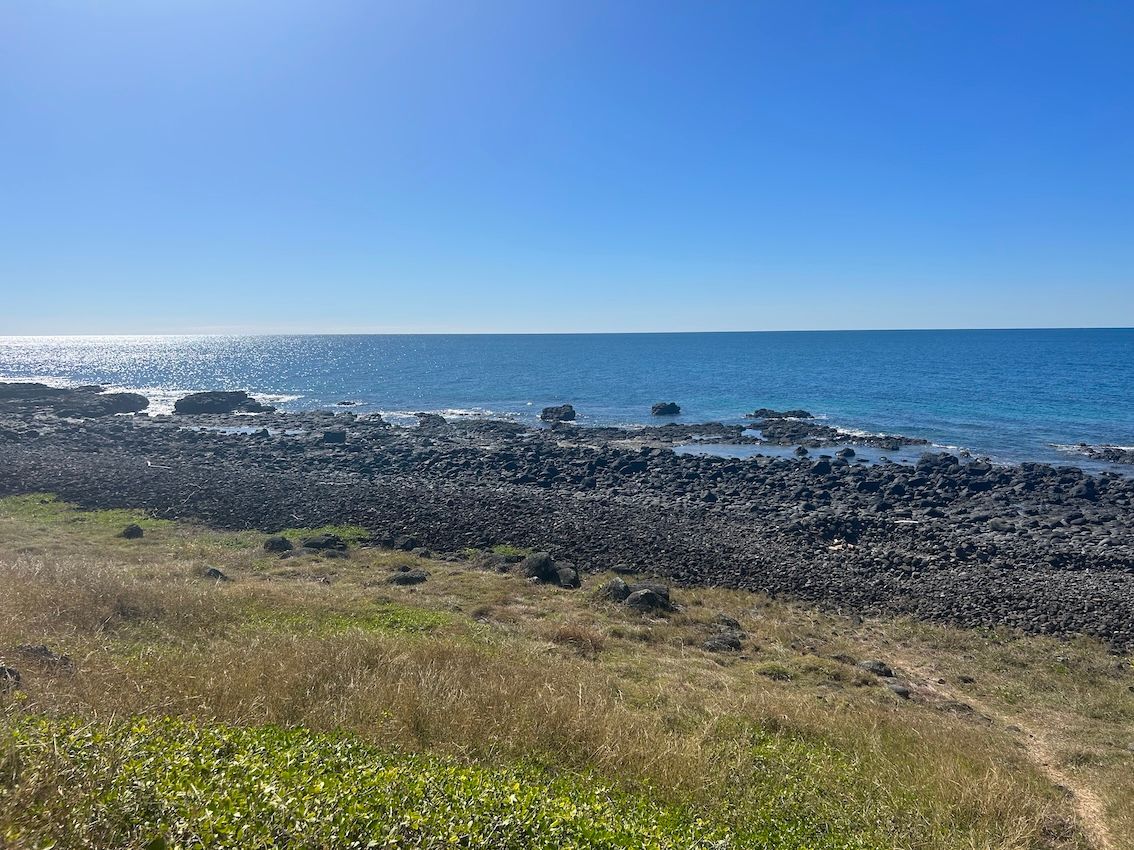 A View of Rocks Overlooking a Body of Water — Aqualine Pools in Innes Park, QLD