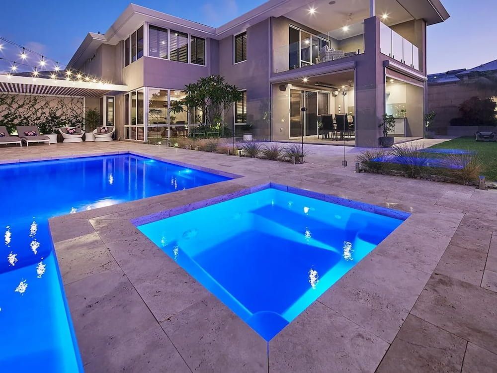 A Large House With Two Swimming Pools and a Hot Tub — Aqualine Pools in Branyan, QLD