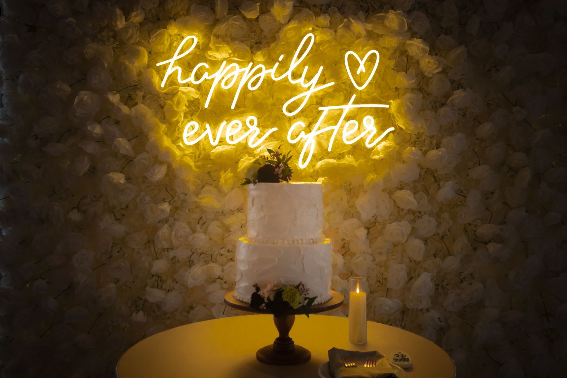 Wedding cake on a table; illuminated 