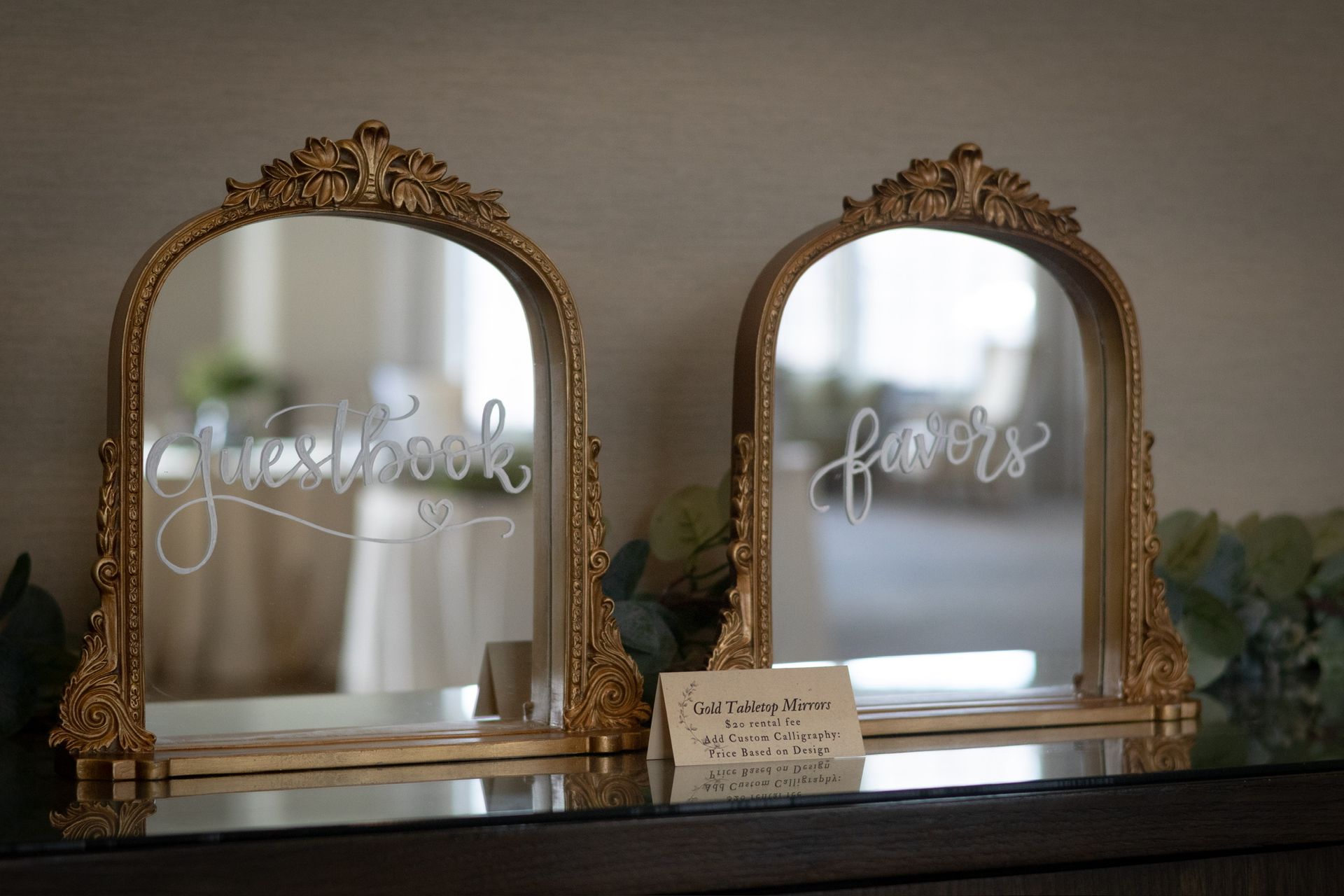 Two ornate gold mirrors labeled 