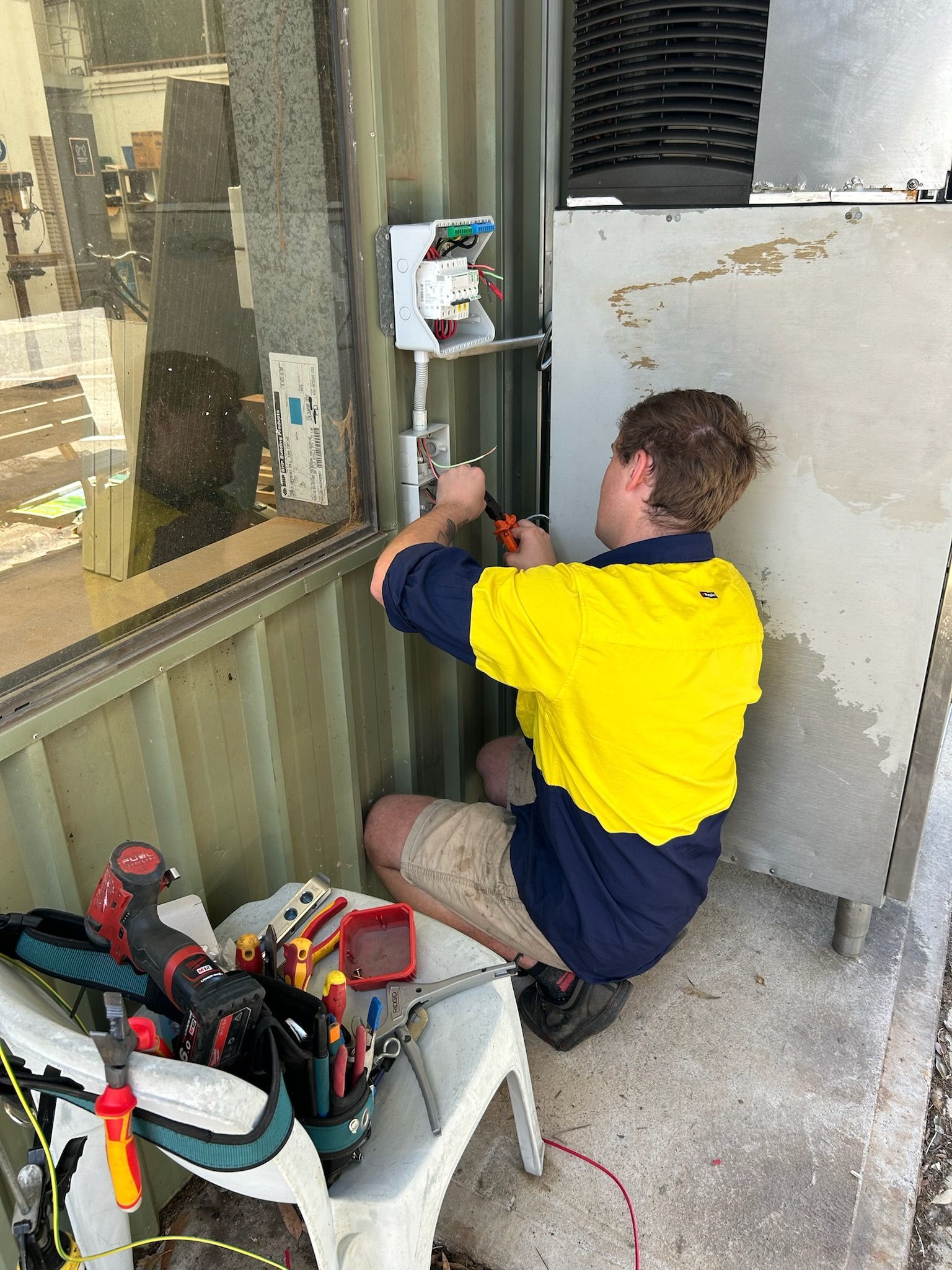 Electrician Is Using A digital Meter To measure The Voltage — Mingleford Electrical Airconditioning Solar & Gas In Landsborough, QLD